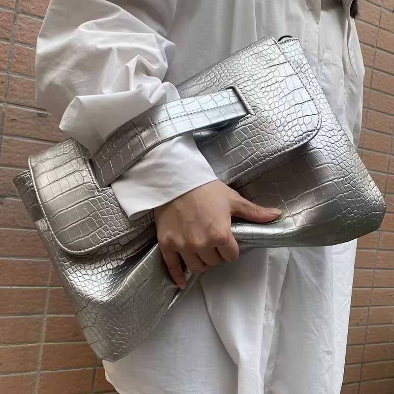 Silver crocodile embossed crossbody bag with adjustable strap